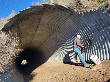 Larry fixes culvert