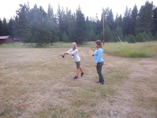 shown is MWF Field Representative Morgan Marks helping a BOW participant with casting their fly rod.