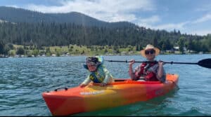 Emily Clewis on a lake with her son